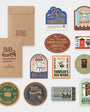Collection of travel-themed stickers and notebook on a white background