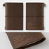 Brown leather notebook with '20th Traveller's' branding on a white background