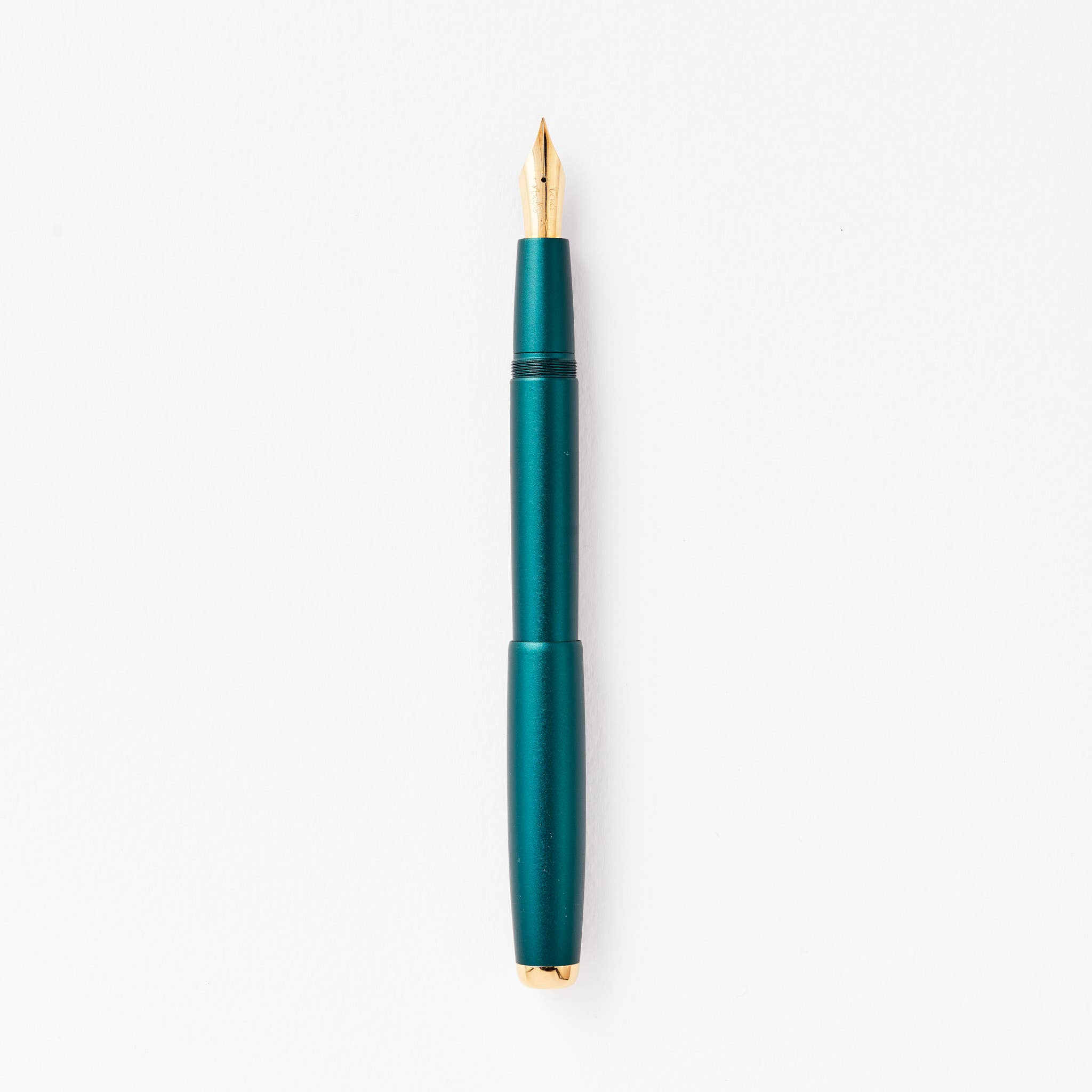Ivy fountain pen with gold accents on a white background