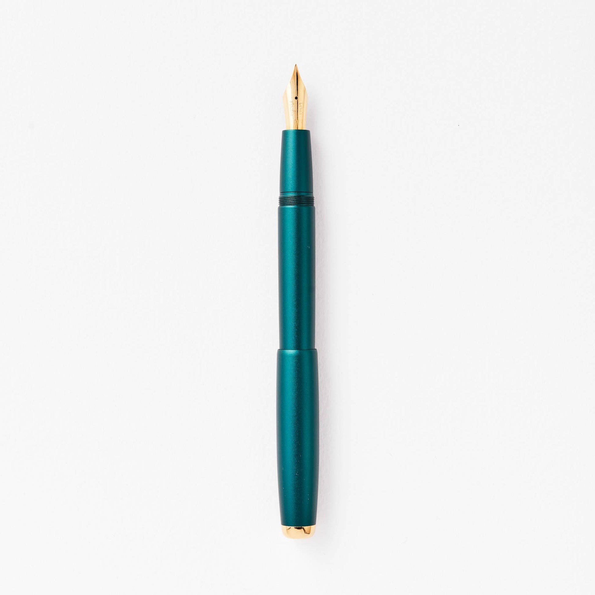 Ivy fountain pen with gold accents on a white background