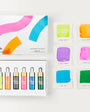 Set of colorful ink bottles and color swatches on a white background