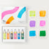 Set of colorful ink bottles and color swatches on a white background