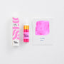 Pink ink bottle with packaging and color swatch on a white background