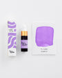 Purple ink product with packaging and color swatch on a white background