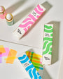 Colorful ink bottles and boxes on a light background