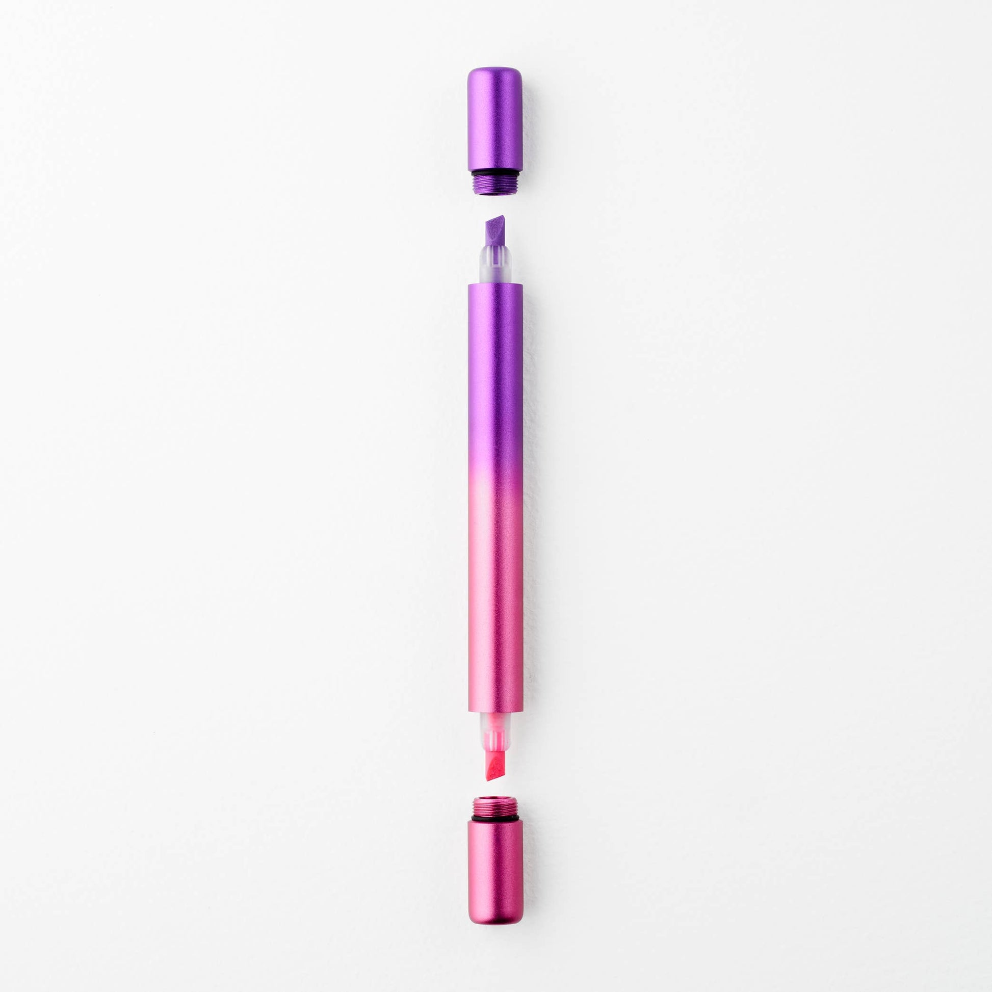 Purple and pink pen on a white background