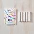 Toni's Studio Ori spare reservoirs packaging with white strips on a light wooden surface