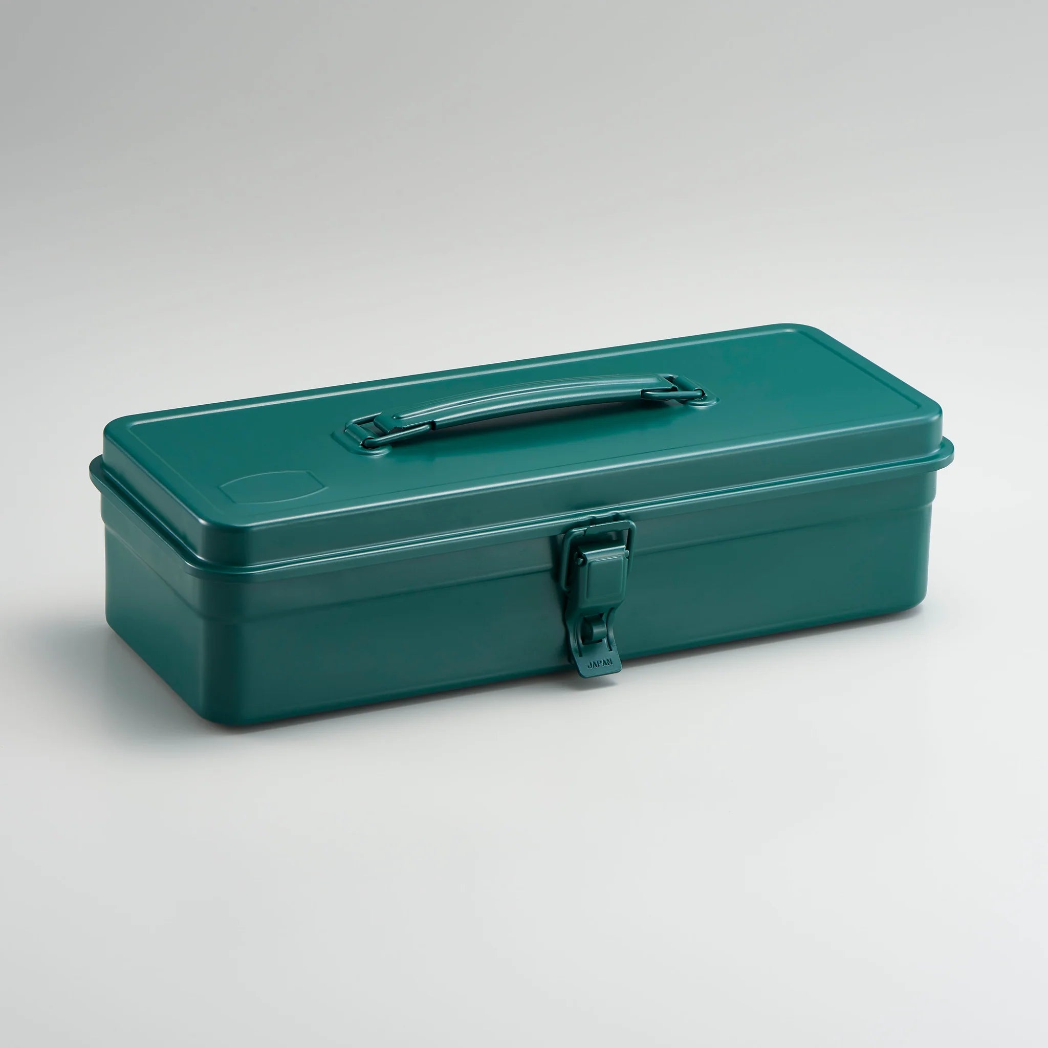 Green toolbox with a handle on a light gray background