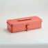 Coral-colored tool box on a light gray background
