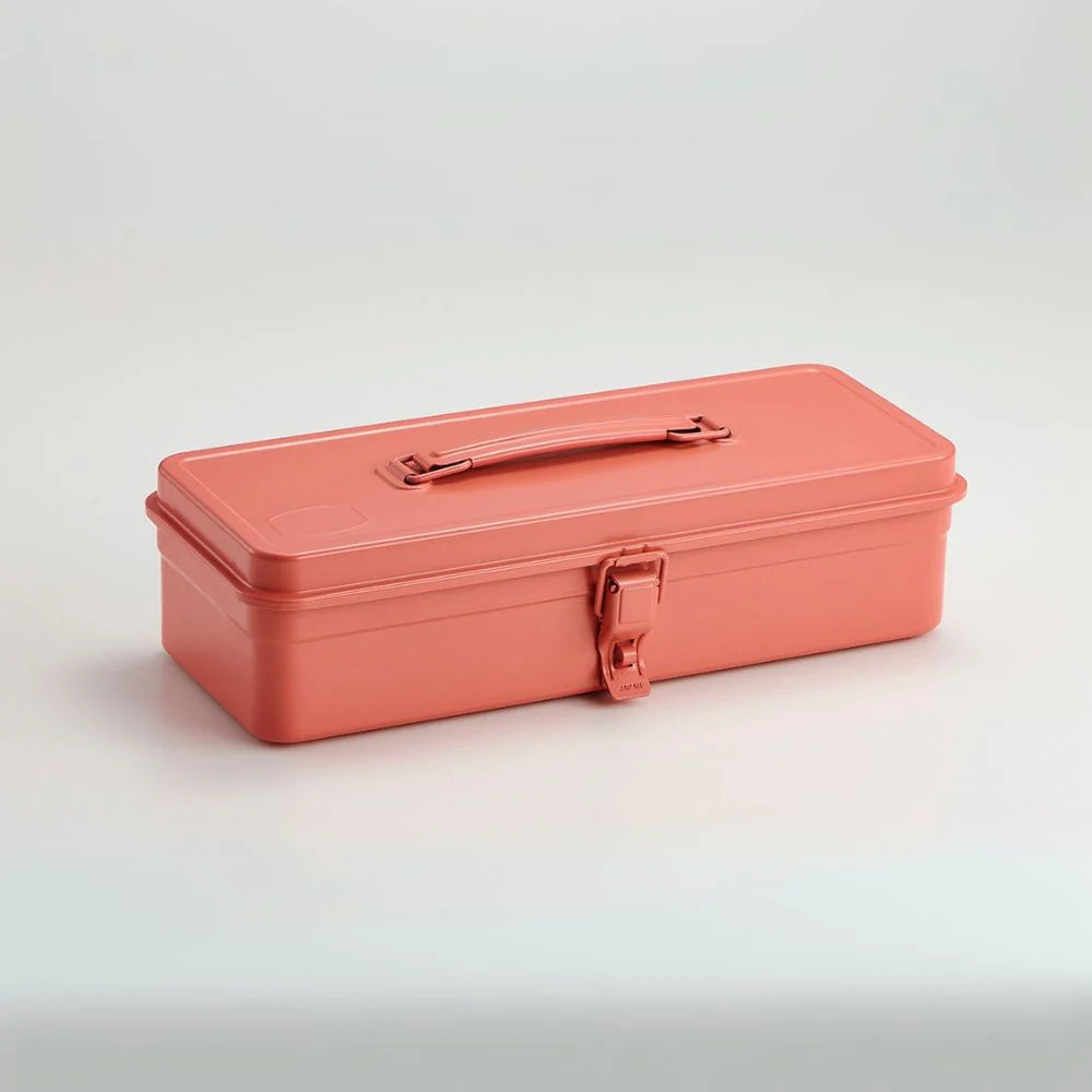 Coral-colored tool box on a light gray background