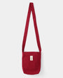 Red shoulder bag on a white background