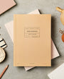 Ochre colour notebook on a table