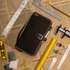 Brown leather portfolio with tools on a newspaper background