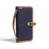 Navy blue and brown bag with strap on a white background