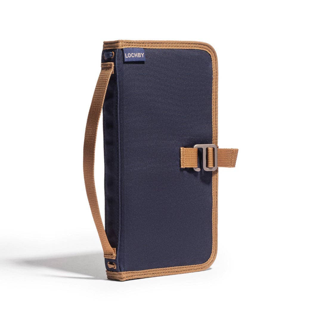 Navy blue and brown bag with strap on a white background