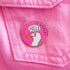 Pin with a seagull design and text on a pink background