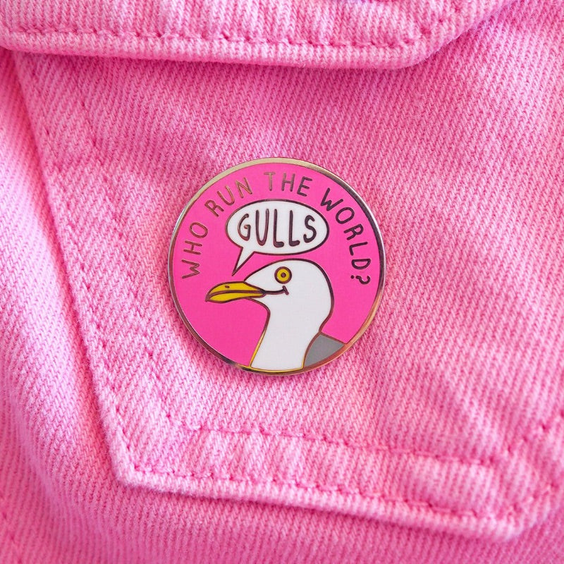 Pin with a seagull design and text on a pink background