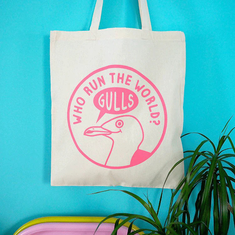 Tote bag with 'Who Run the World? Gulls' design on a blue background