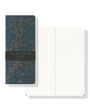 Notebook with star map design on cover and white interior pages