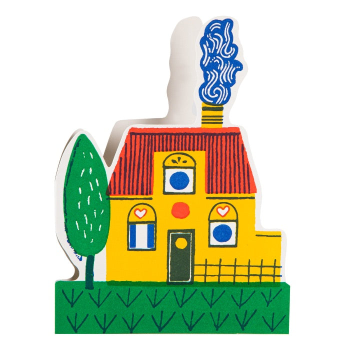 Colorful house-shaped object with a tree on a white background
