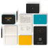 Collection of bullet notebooks and a pen on a white background