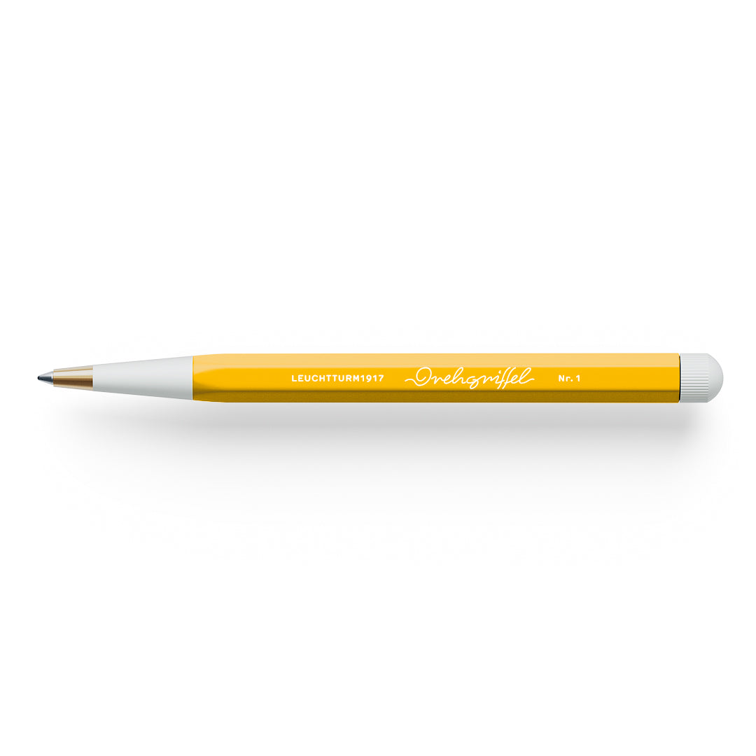Pen with yellow barrel and white grip on a white background