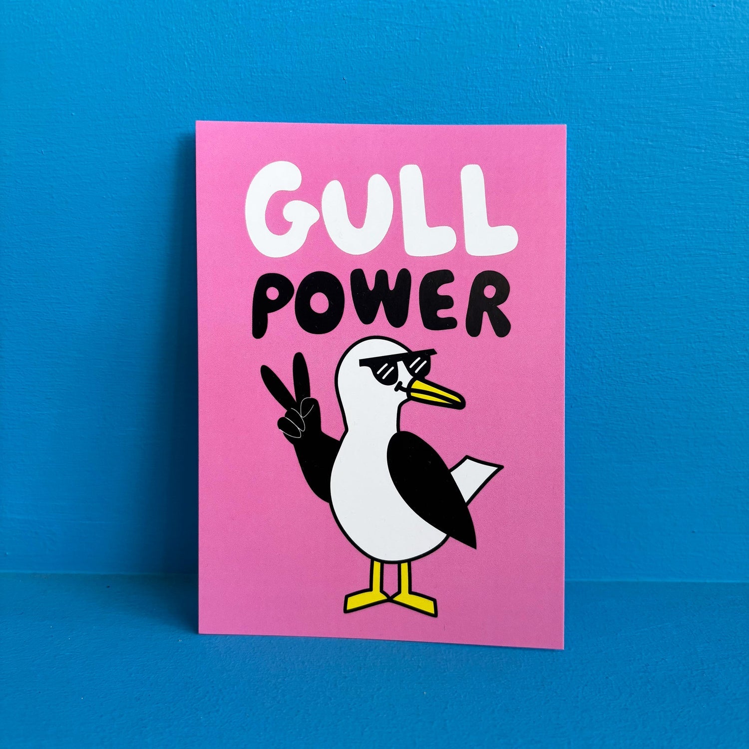 Card with a cartoon seagull and 'Gull Power' text on a pink background