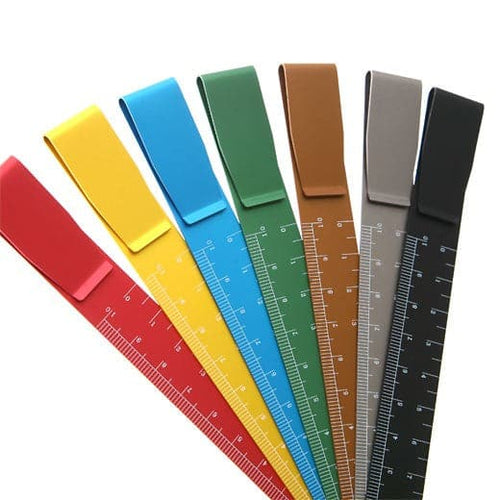 Set of colorful rulers with measurement scales on a white background