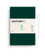 Green notebook with white pen on a white background, featuring Leuchtturm1917 branding.