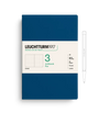Leuchtturm1917 notebook with a pen on a white background