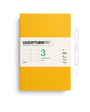 Yellow notebook with white label featuring 'Leuchtturm1917' on a white background