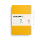 Yellow notebook with white label featuring 'Leuchtturm1917' on a white background