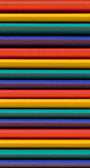 Stack of colorful straws in various bright colors.