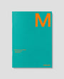 Teal planner with an orange 'M' on a gray background