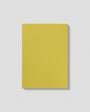 Yellow notebook with 'mous' branding on a light gray background