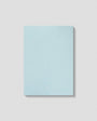 Light blue notebook on a light gray background