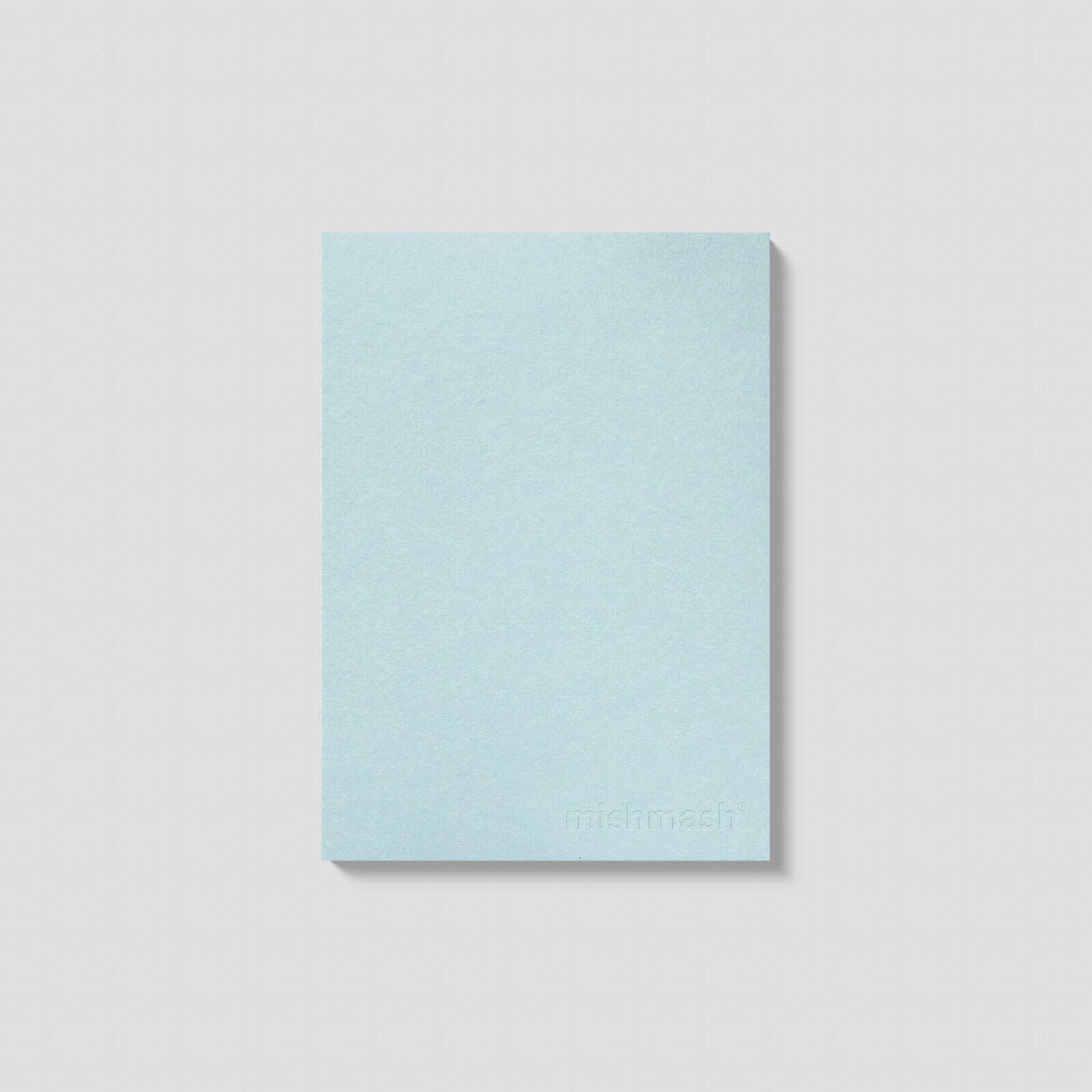 Light blue notebook on a light gray background