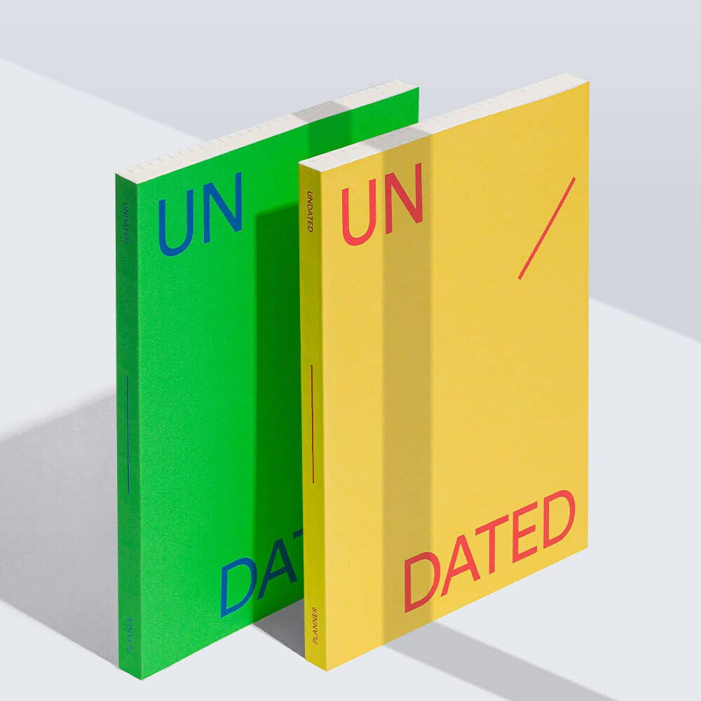 Two books, one green and one yellow, with 'UNDATED' text on a white background.