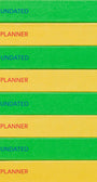 Stack of green and yellow planners with 'Undated Planner' text on each layer.