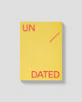 Yellow book with 'UNDATED' text on a gray background