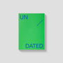 Green book with 'UN DATED' text on a gray background