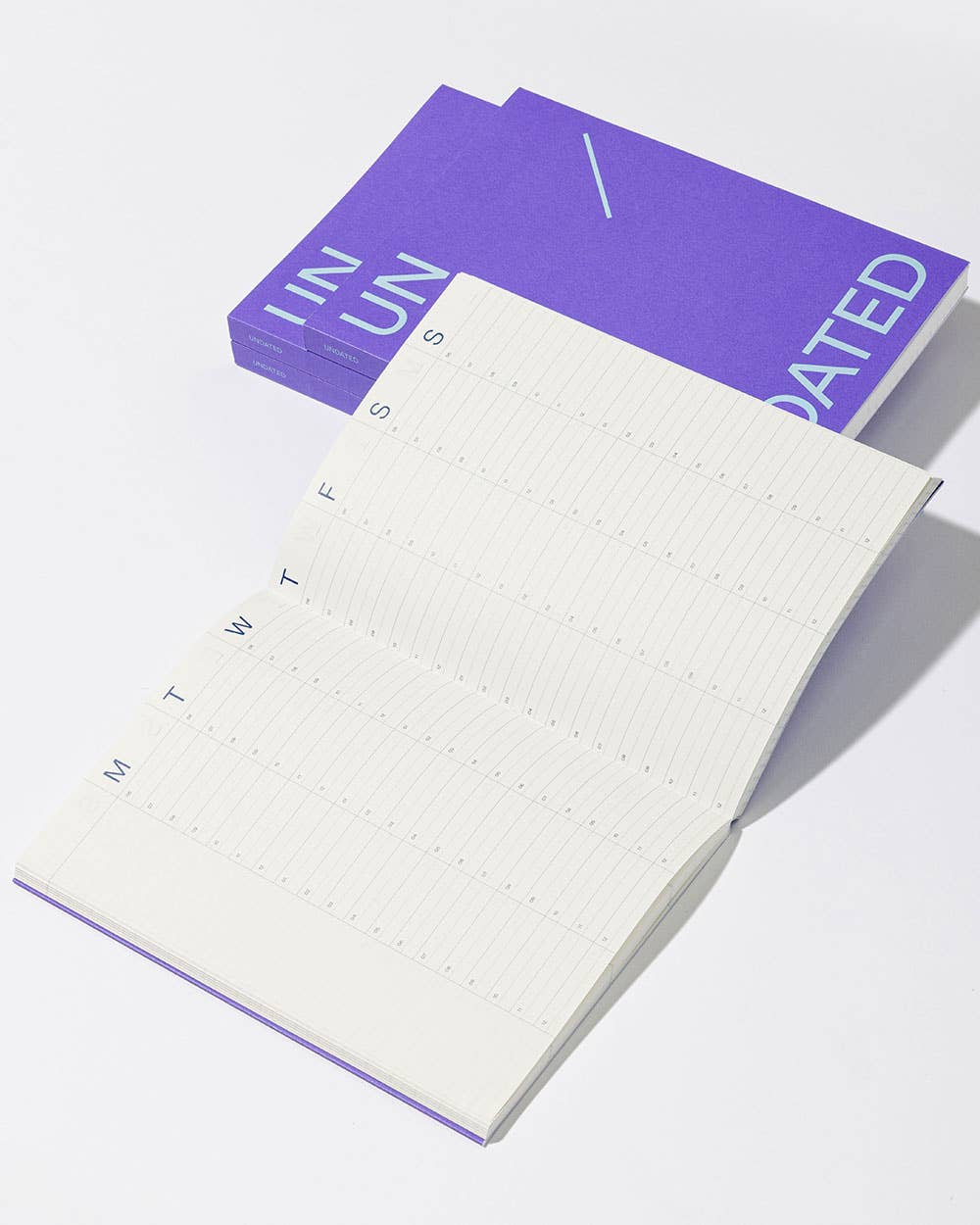 White notepad with purple border and text on a white background
