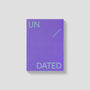 Purple notebook with 'UNDATED' text on a light gray background