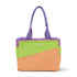 Colorful tote bag with purple handle and green and orange bottom section on a white background