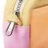 Close-up of a zipper on a multicolored fabric bag with a visible brand logo.