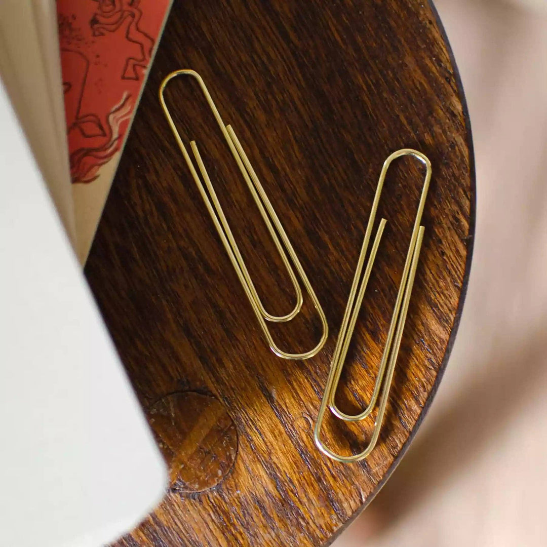 Giant brass paperclips
