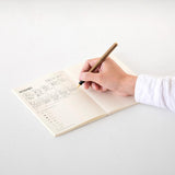 MD paper notebook A5 man writing with pen